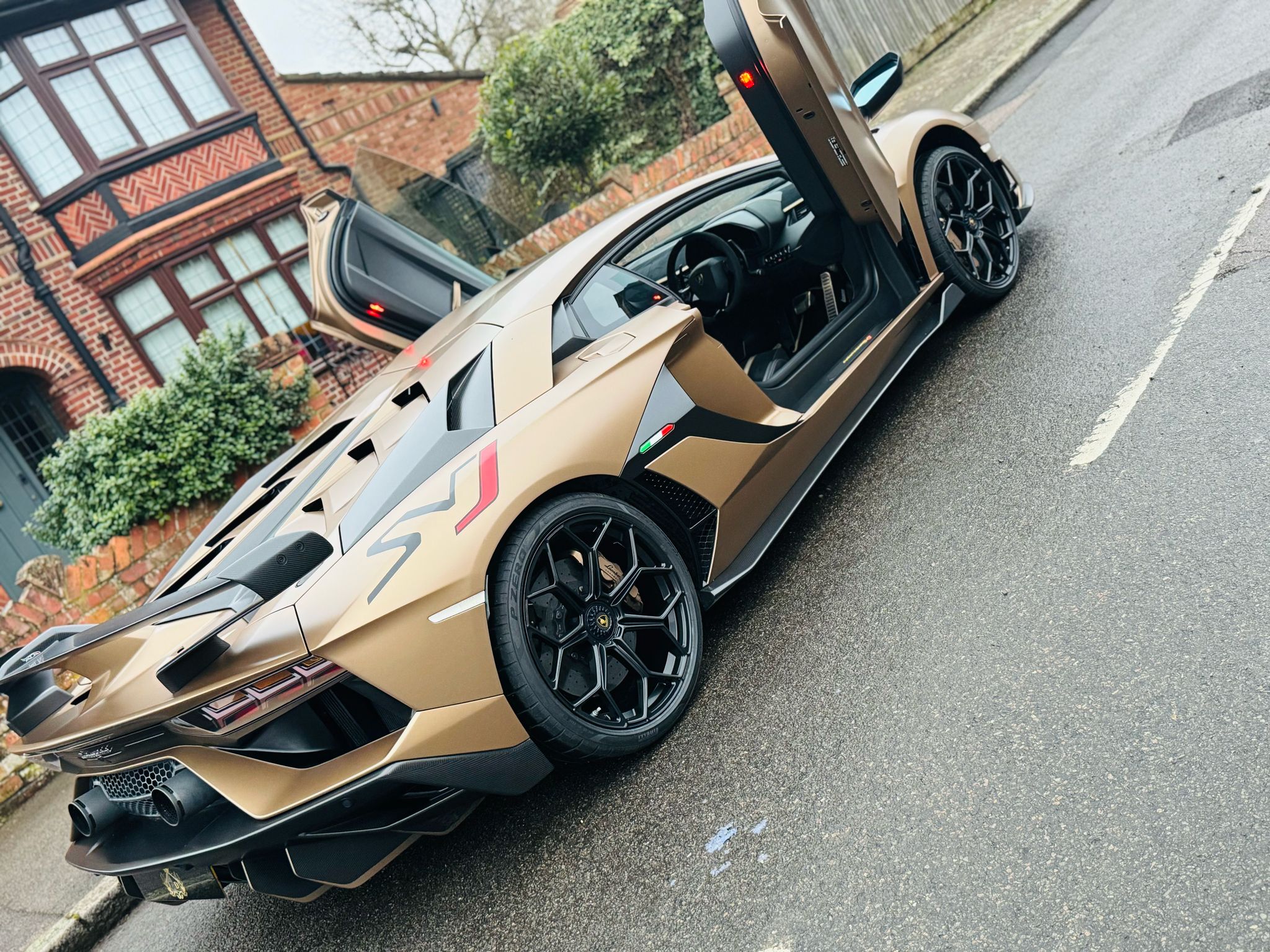 Person driving a luxury sports car